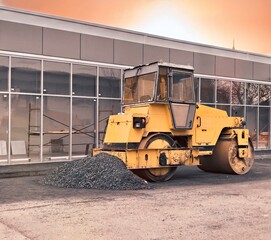 yellow asphalt roller. road construction equipment.