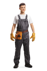 Full length portrait of a young repairman with a tool belt