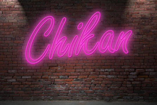Neon Chikan lettering on Brick Wall at night