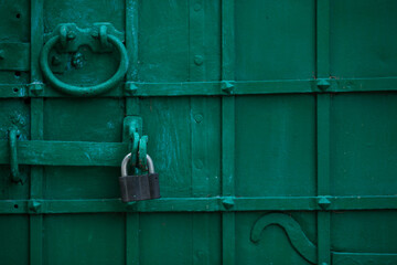 Padlock on the old door.