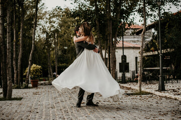 Fototapeta premium bride and groom holding hands wedding dress 