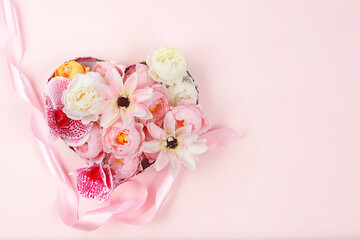 Abstract floral composition, spring background.Flowers in a gift box, minimal holiday concept. Greeting card for womens day, mothers day, happy birthday, wedding, banner, flower delivery,