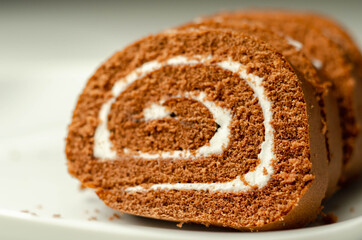 Chocolate sponge roll with a vanilla flavour filling, chocolate swiss roll