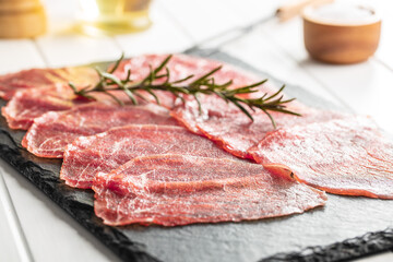 Sliced carpaccio. Raw beef meat.