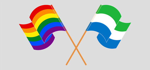 Crossed and waving flags of LGBTQ and Sierra Leone