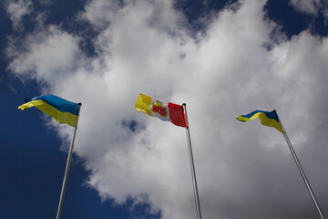 Odessa city and national flag on blue sky background Ukraine