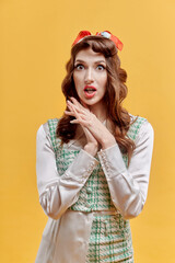 A surprised brunette woman with wavy hair and bright makeup looks at the camera. Pin-up style. Yellow background.