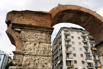 Thessaloniki, Greece, 09/28/2017: Arch of Galerius and buildings in the background