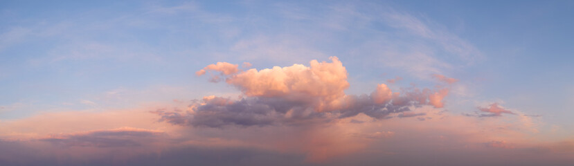 Obraz premium panorama of a bright dramatic twilight sky, beautiful clouds at dawn