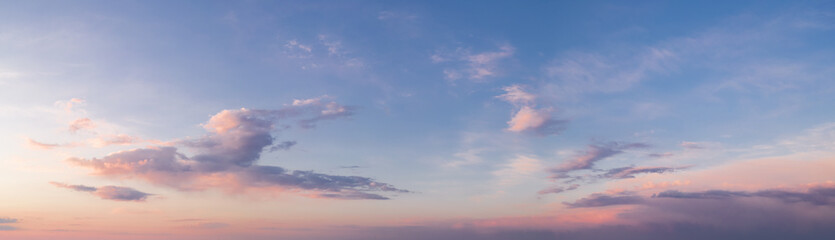 Naklejka na ściany i meble panorama of a bright dramatic twilight sky, beautiful clouds at dawn
