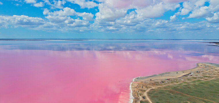 Aerial Panoramic Image Bright Pink Lake Water With Shore