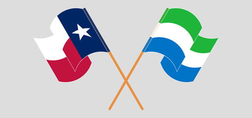 Crossed and waving flags of the State of Texas and Sierra Leone