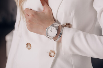 Stylish silver white watch on woman hand
