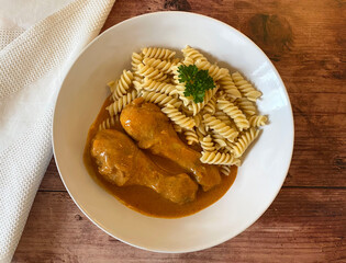 Hungarian paprika chicken, also known as chicken paprikash in juicy creamy sour cream sauce with...
