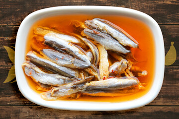Sauced anchovies on the table, appetizer
