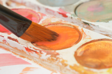 Obraz premium Close up image of a paint brush. Creative hobby or art therapy concept.