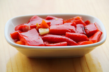 red peppers cooked in embers on the table