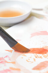 Close up image of a paint brush. Creative hobby or art therapy concept.