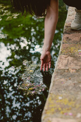 touching water in lake moment relaxing