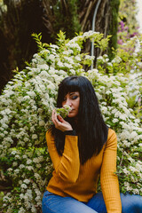 girl feeling nature smelling flowers
