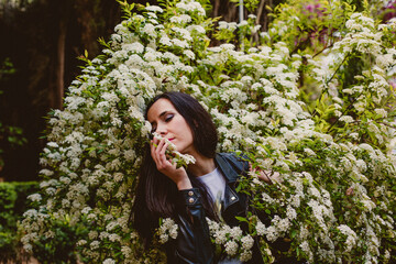 girl feeling nature smelling flowers