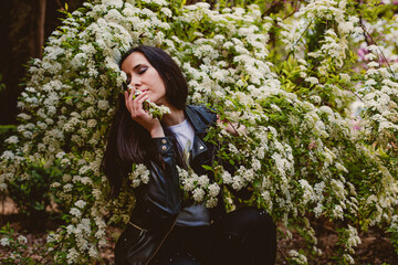 girl feeling nature smelling flowers