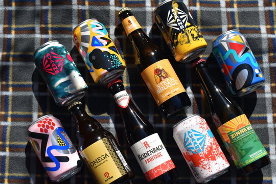 Belgian beers in London, UK on April 4 2021 are ales opposed to lagers with fruity yeast flavours malts. They are spontaneously fermented the wort is open to air allowing local yeasts and bacterias in