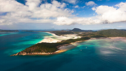 Aerial shot of Hill Inlet over Whitsunday Island - swirling white sands, sail boats and blue green water make spectacular patterns