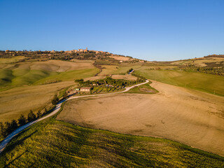 Scenic view of the idyllic countryside near Pienza in Val d'Orcia Natural Area, Tuscany, Italy.  Aerial view, drone shot.