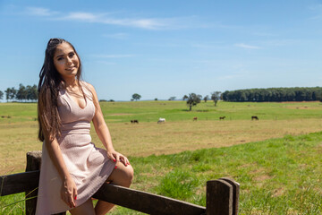 Beautiful brunette girl posing on photos in nature