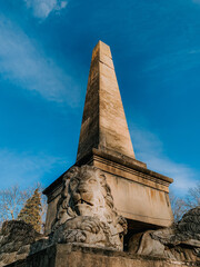 Low angle shot of the Obelisk of Lions in Copou Park in Iasi, Romania