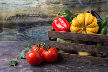 assorted fresh vegetables in a wooden box