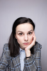 woman manager in suit on gray background