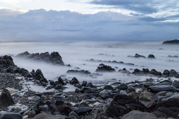 Fototapeta na wymiar Layer of rocks on the beach coastline.