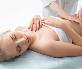 Obraz premium Pretty blonde enjoying massage in saloon