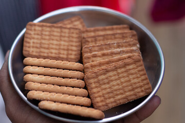 Obraz na płótnie Canvas Plate full of biscuits or cookie. Parle G biscuits in the plate