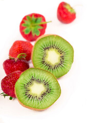 slice of juicy delicious and healthy ripe kiwi and strawberry isolated on white background