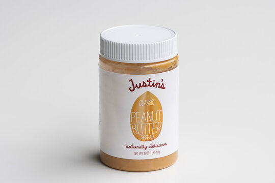 Portland, OR, USA - Mar 14, 2021: Justin's Classic Peanut Butter Isolated On White Background. Justin's Is An American Brand Of Natural And Organic Nut Butters And Peanut Butter Cups Owned By Hormel.