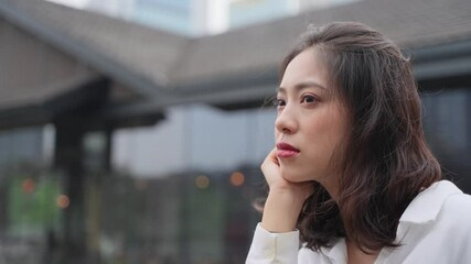 4k slow motion portrait of lovely asian lady relax in the urban city with wind blowing hair attractive Chinese young woman close up  4k clip