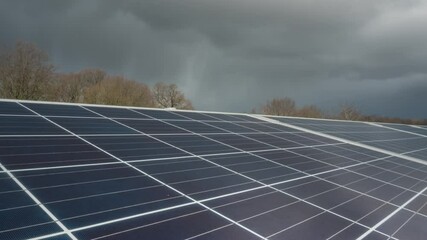 Clouds time lapse over solar farm panels, renewable sustainable energy - Powered by Adobe