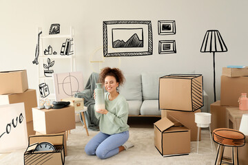 Young woman with belongings in her new home on moving day