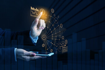 Young businesswoman with mobile phone using virtual screen on dark background. Concept of internet