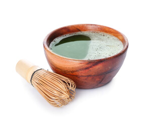 Bowl with matcha tea and chasen on white background