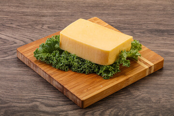 Tasty yelloow Tilsiter cheese brick