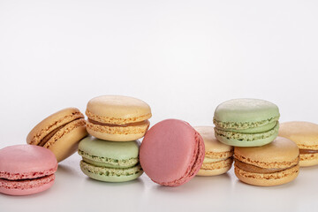 French biscuit biscuits of different colors. Macarons, close-up, studio shot.
