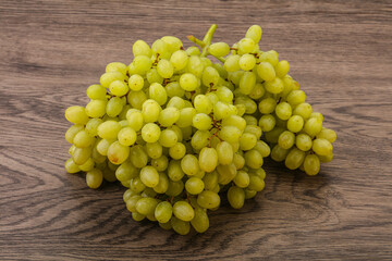 Green grape branch over background