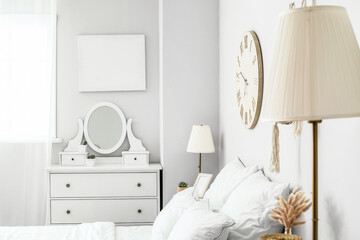 Interior of light modern bedroom with lamp