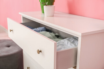 Modern chest of drawers in room, closeup