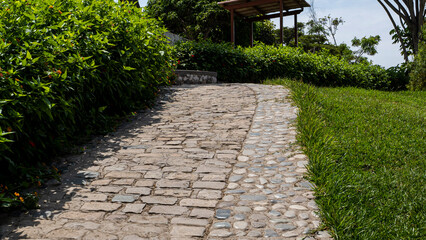 Stone path with green gardens