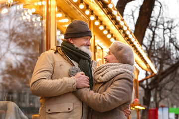 Happy mature couple outdoors on winter day